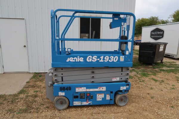 A scissors lift on the grass